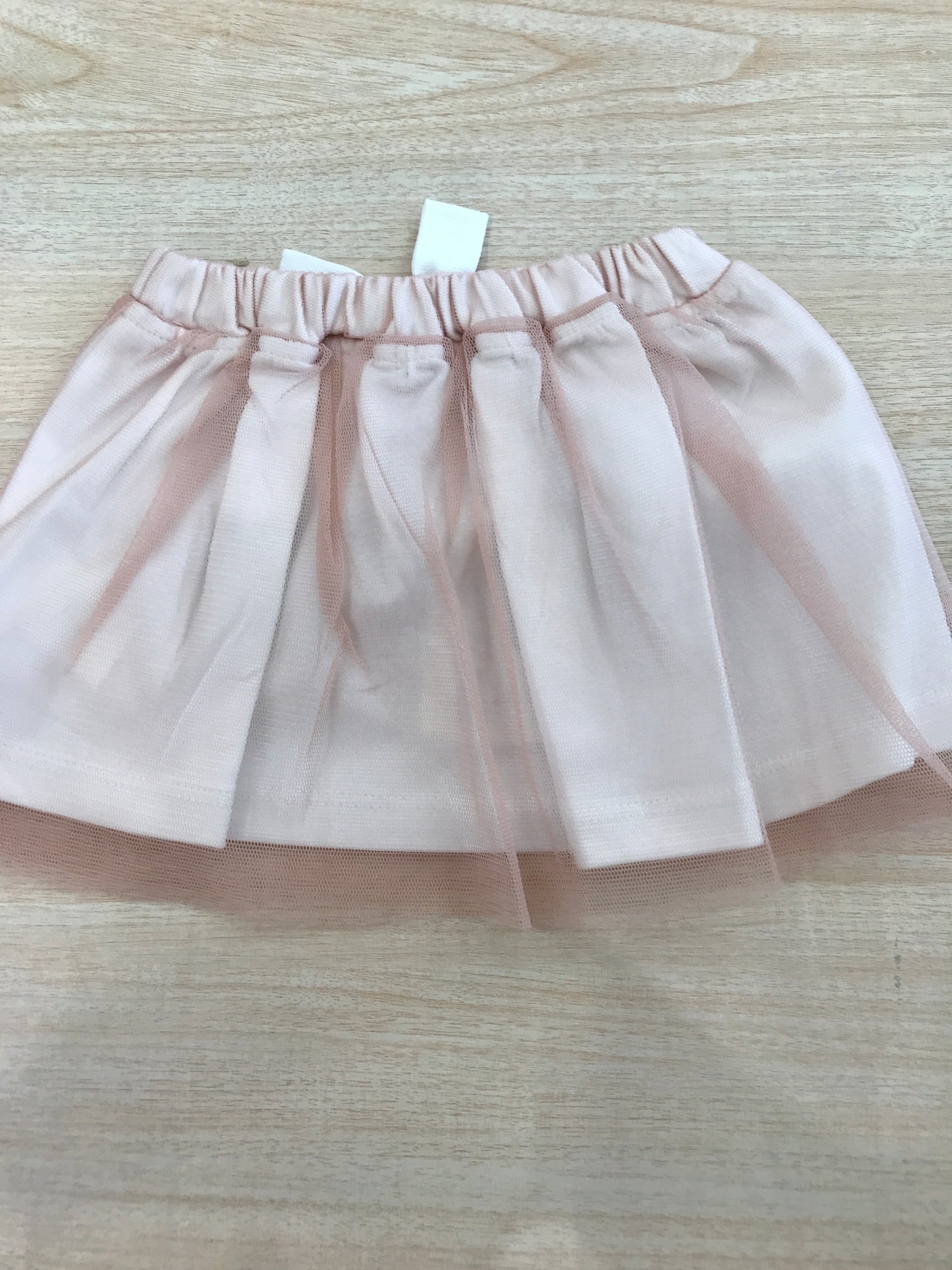 Gonna Coccodè in cotone con strato in tulle rosa con fiocchetto sul davanti