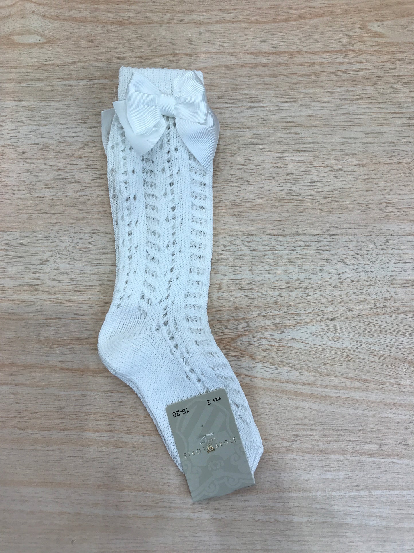 Calzino Story Loris in filo bianco alto traforato con fiocco