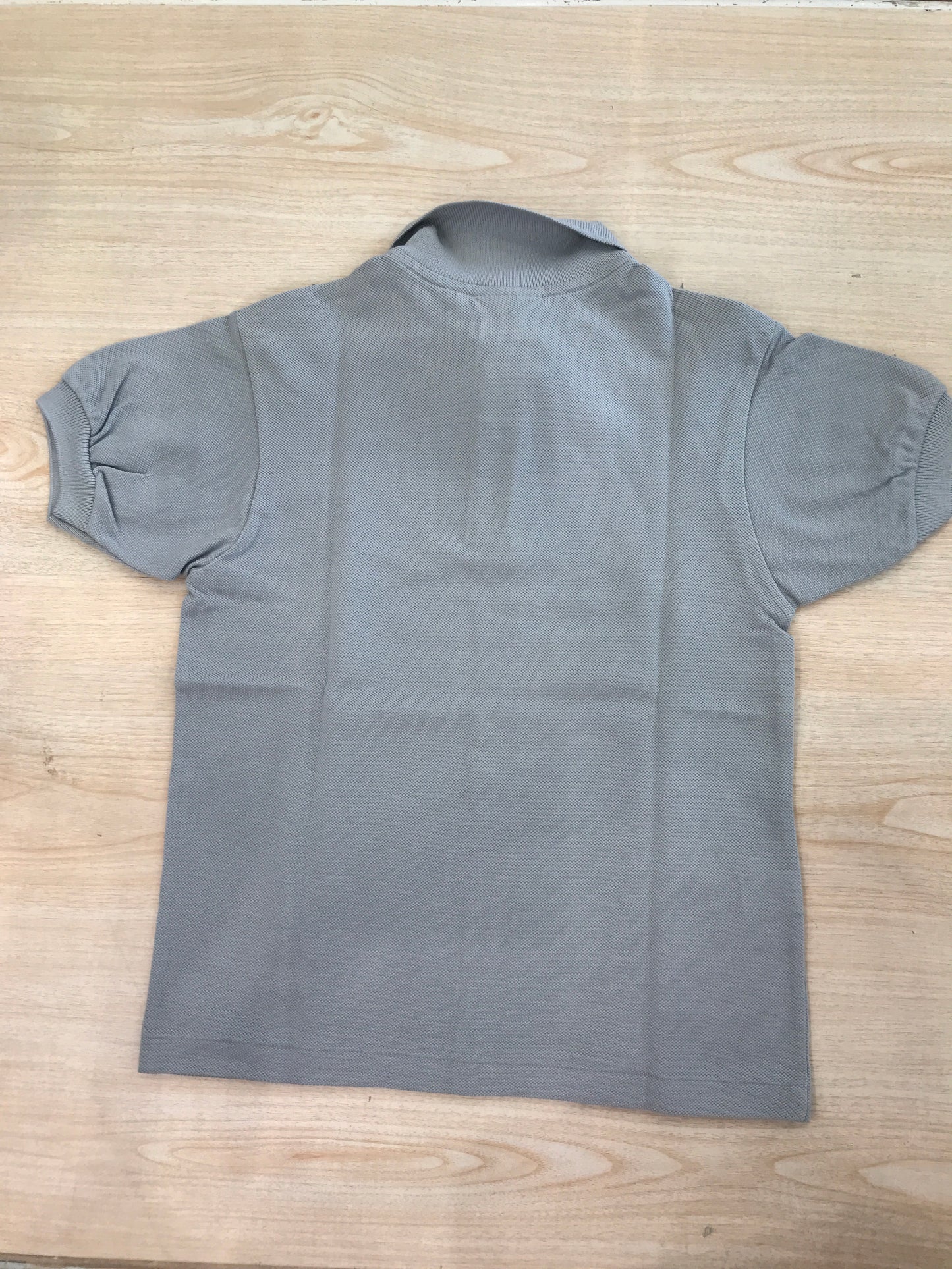 Polo Lacoste in cotone mezza manica con bottoncini e logo ricamato lateralmente unisex