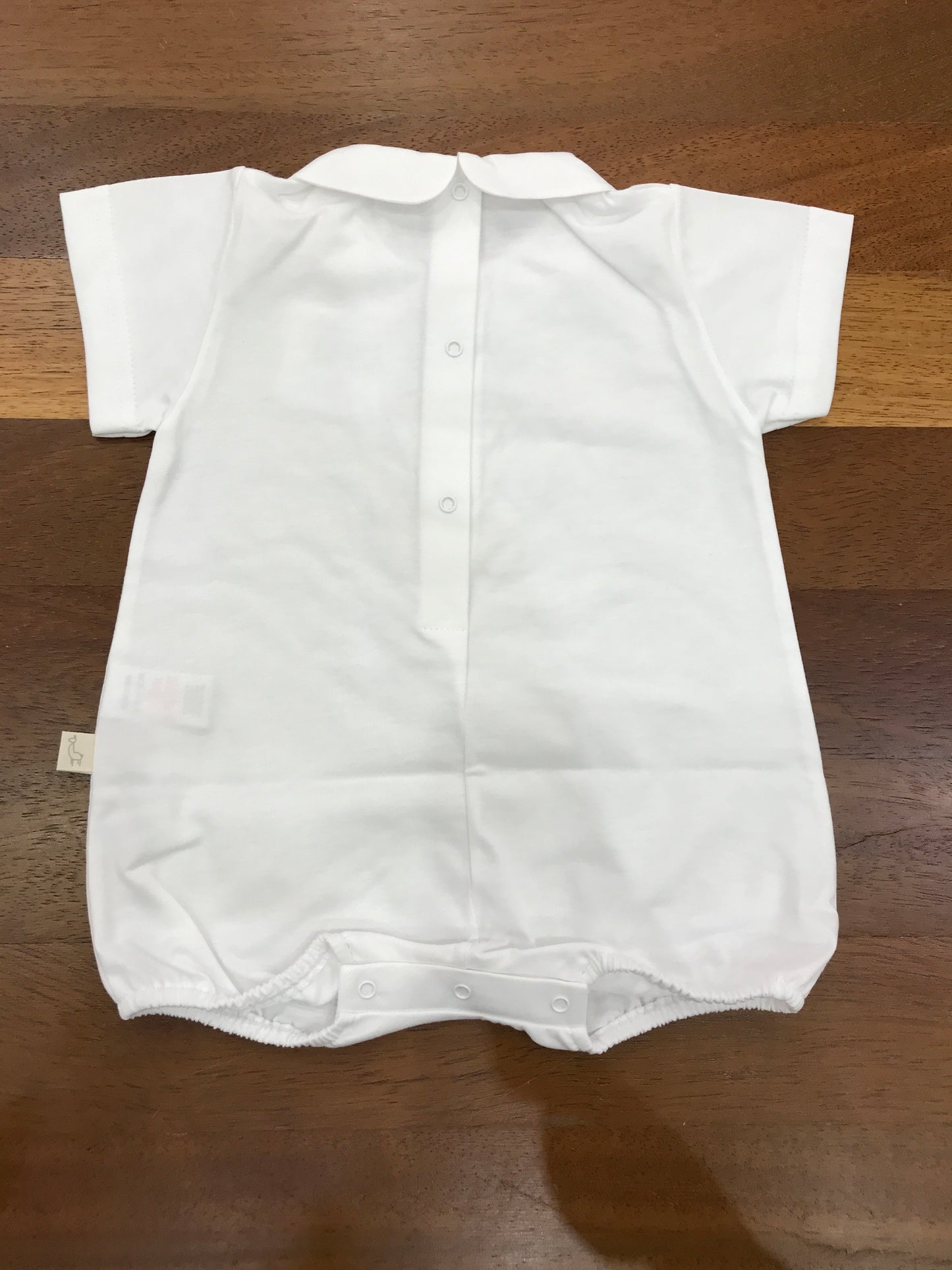 Pagliaccetto Baby Gi bianco corto mezza manica con collo tondo con orsetto applicato sul davanti con fiocco