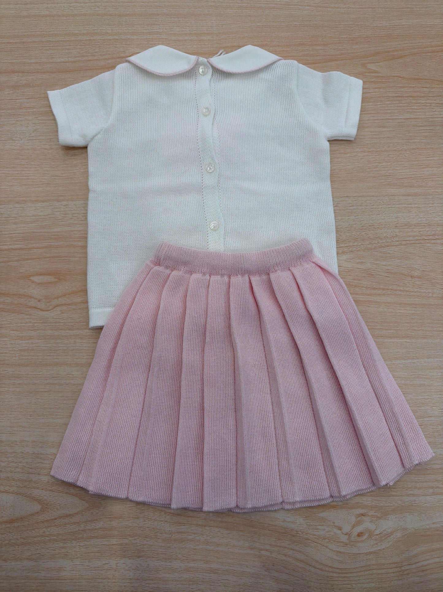 Completo Baby Lord in filo bianco mezza manica con fiocco centrale con gonna rosa plissettata