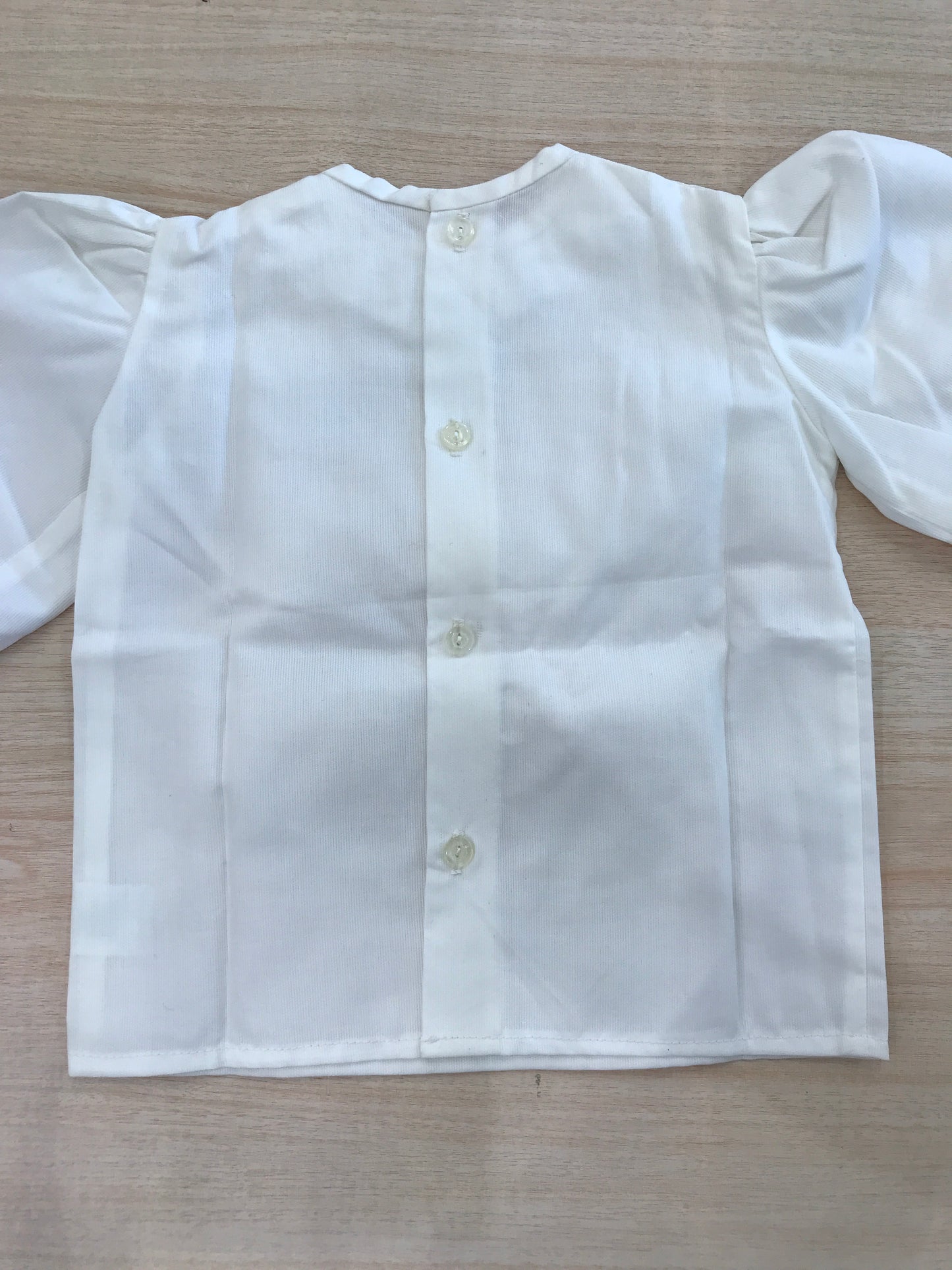 Camicia Le Chicche Della Nonna in cotone bianca con maniche a sbuffo e collo con rusche e lavorazione i punto smock