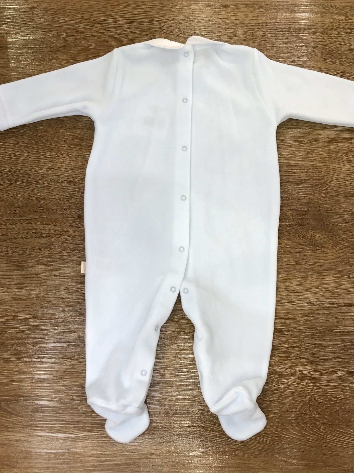 Tutina Baby Gi in ciniglia celeste intera con colletto bianco e cavallo a dondolo ricamato sul davanti