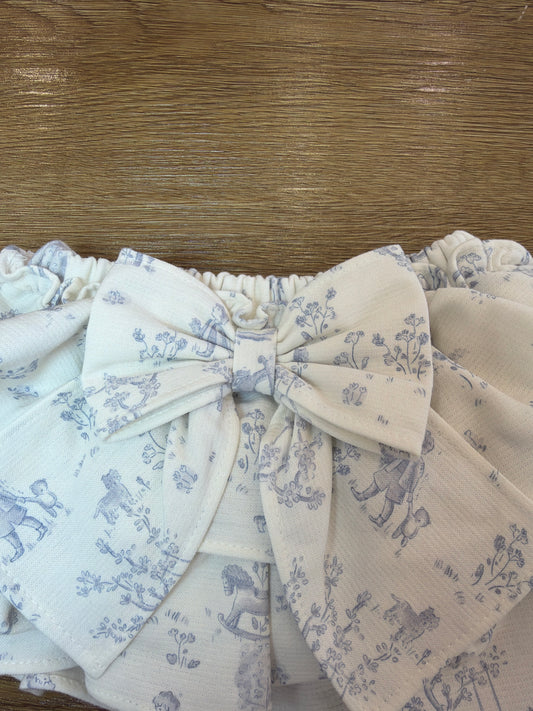 Culotte con doppia balza a fantasia con fiocco sul retro