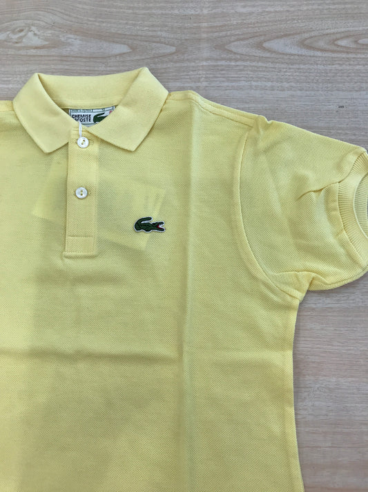 Polo Lacoste in cotone mezza manica con bottoncini e logo ricamato lateralmente unisex
