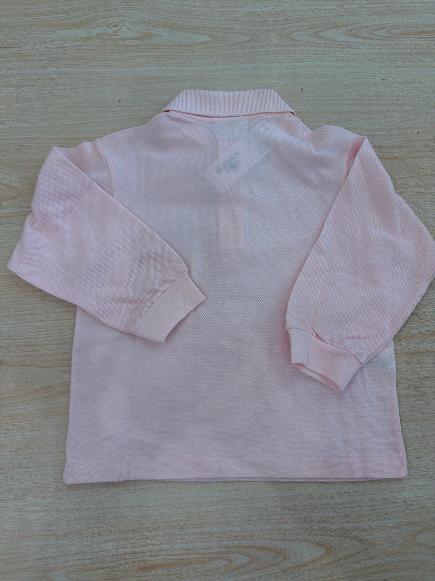 Polo Lacoste in cotone manica lunga con bottoncini e logo ricamato lateralmente unisex