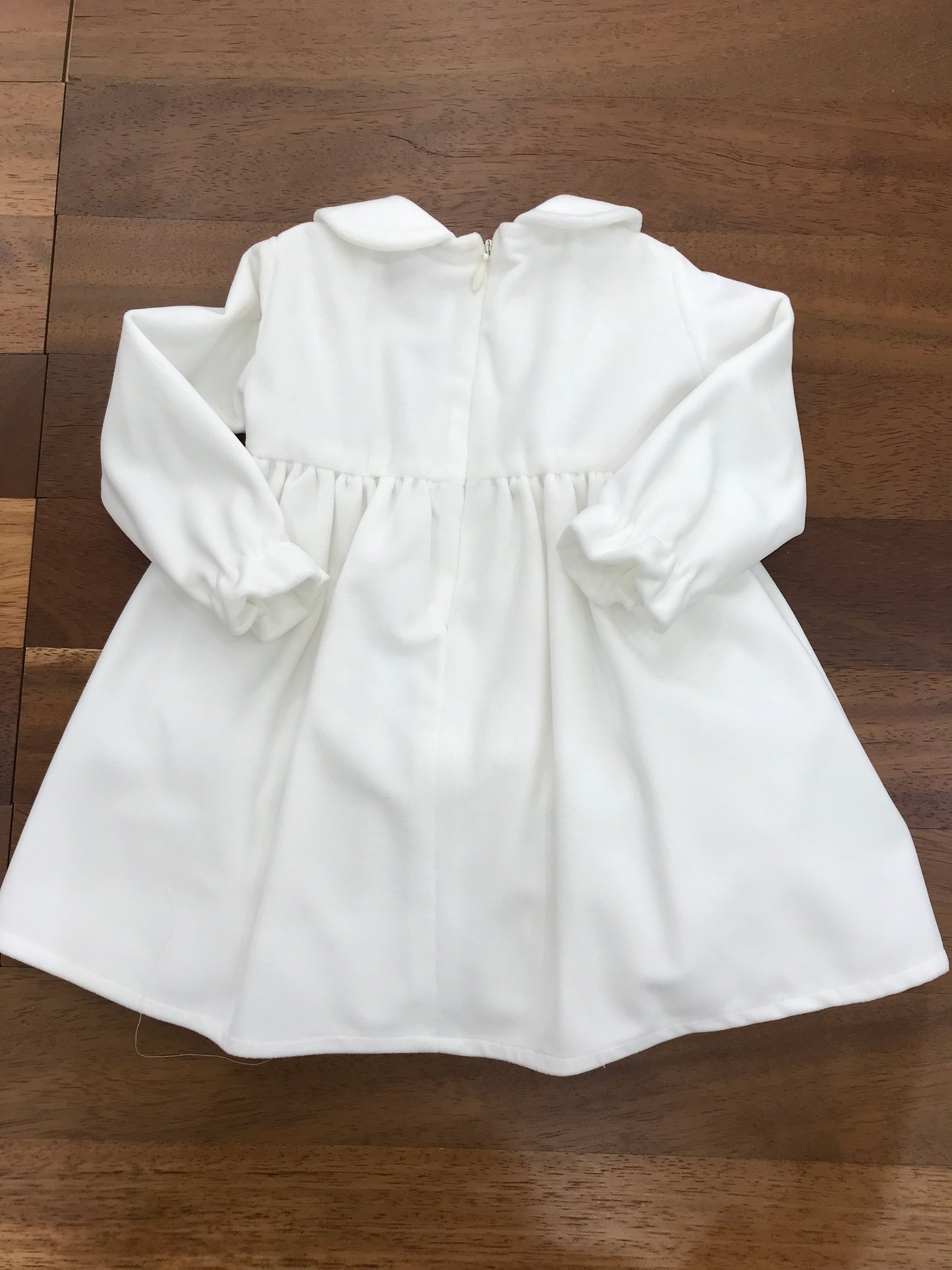 Abitino Colibrì in velluto, con manica lunga con gonna ampia con punto smock sul corpetto