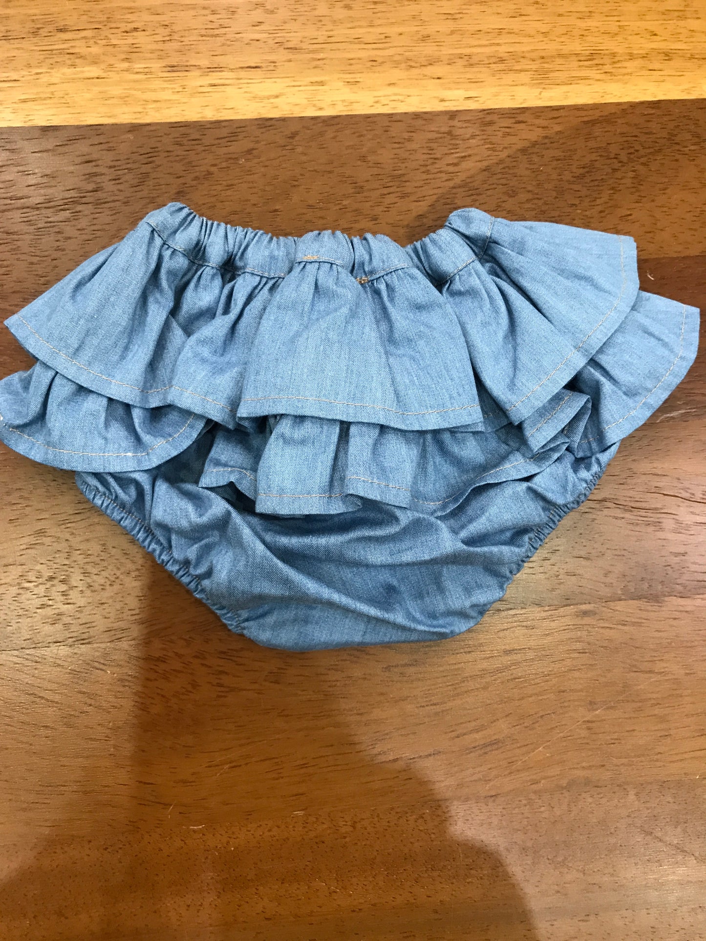 Culotte Baby Gi in cotone color denim con due strati di rusche