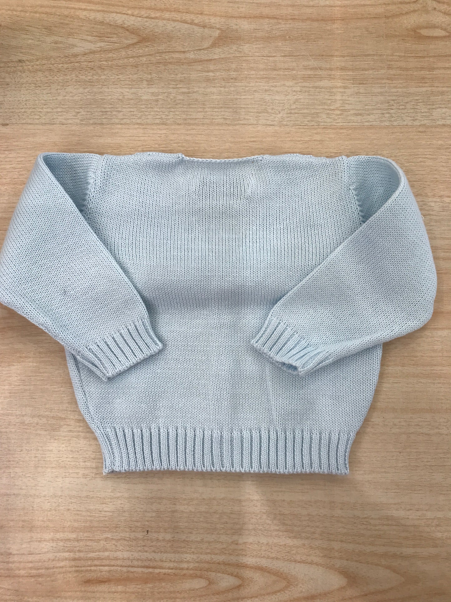 Cardigan Bebè di Almy in filo con lavorazione sul davanti