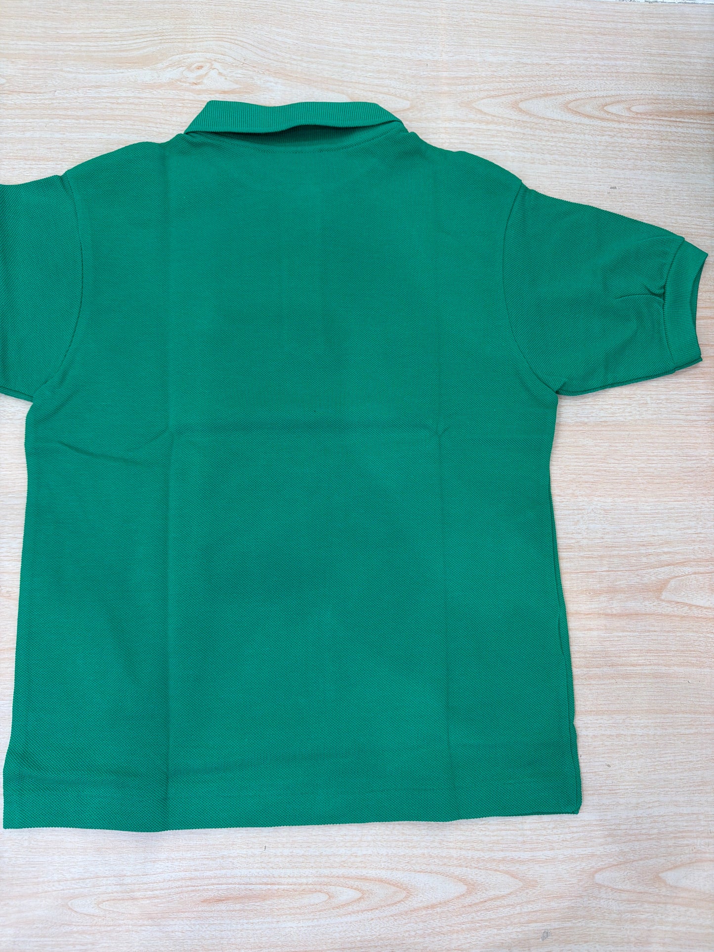Polo Lacoste in cotone mezza manica con bottoncini e logo ricamato lateralmente unisex