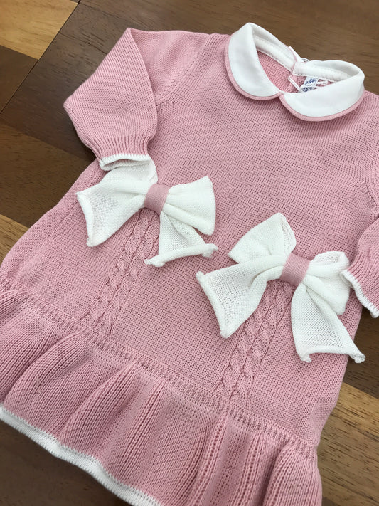 Abitino Bebè di Almy in lana con rusche al bordo,con due fiocchi centrali e lavorazione di trecce