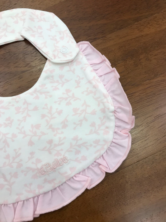 Bavetta Le Bebè in cotone con bordo con rusche rosa di base bianco con fiori rosa