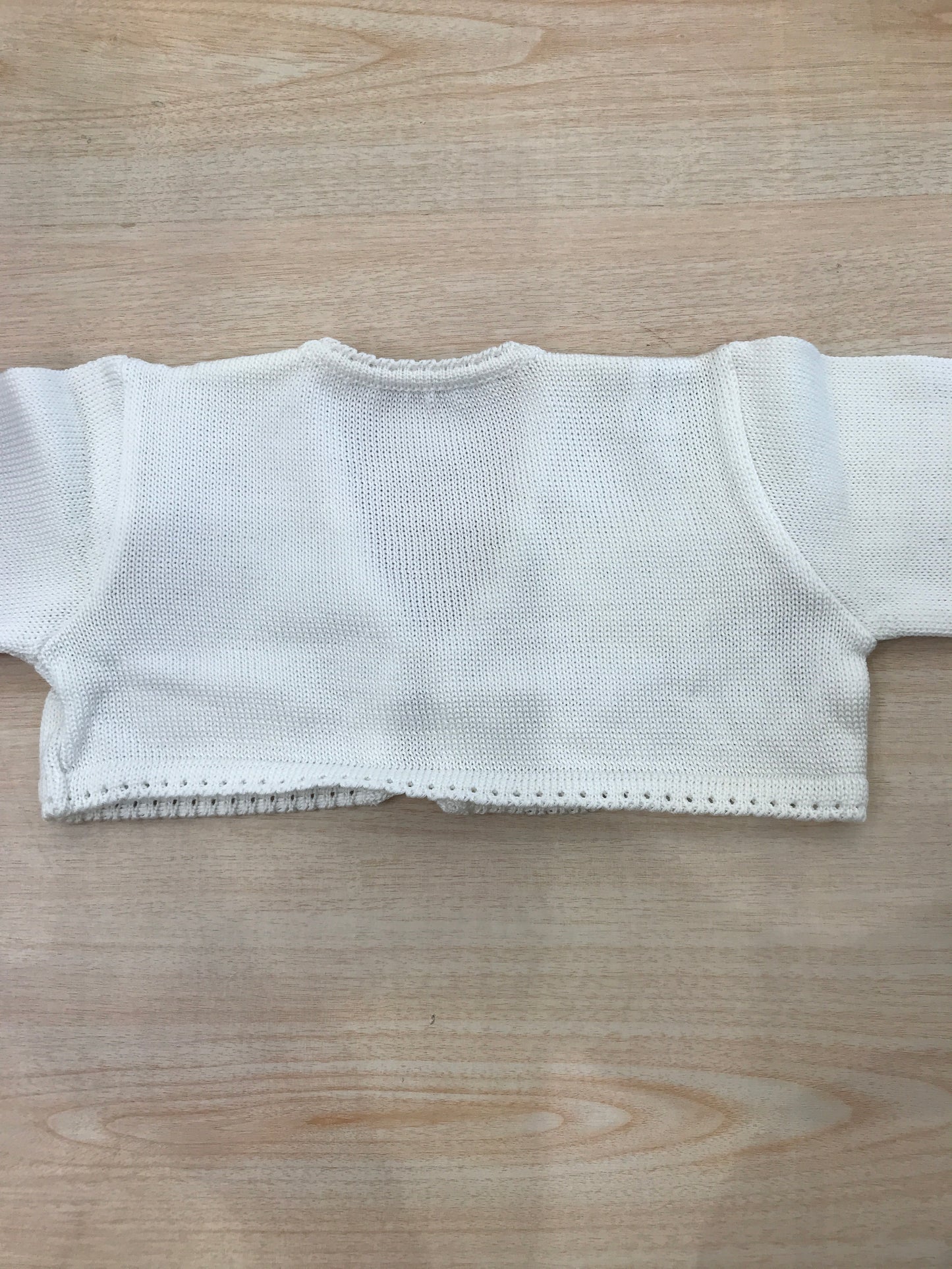 Cardigan Baby Lord in filo panna con lacci per fiocco