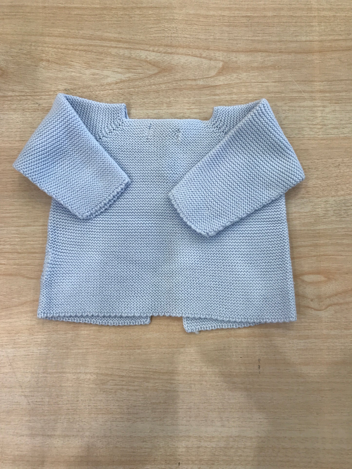 Cardigan PCS in filo celeste con due bottoncini