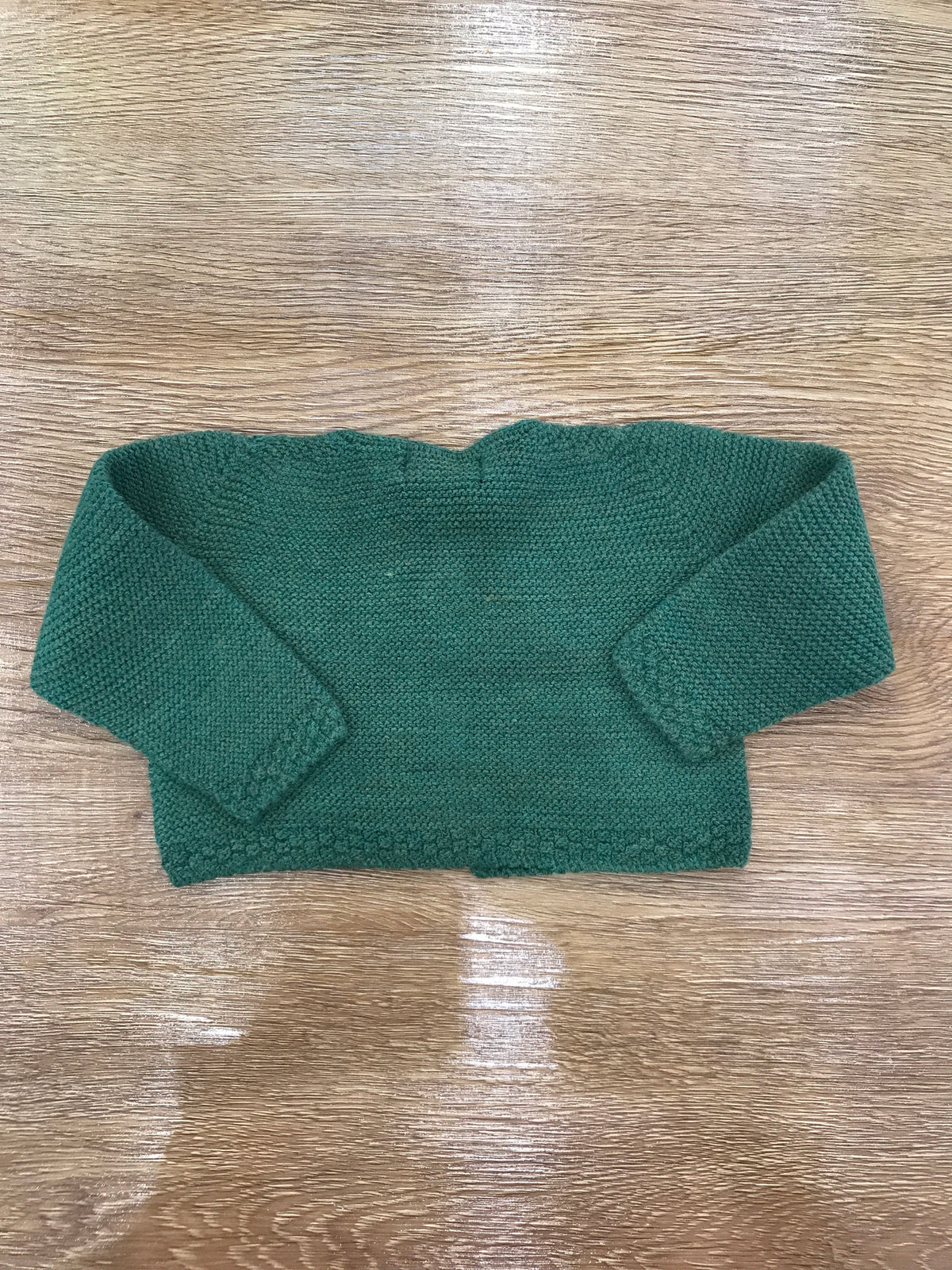 Cardigan PCS in acrilico verde con due piccoli bottoncini