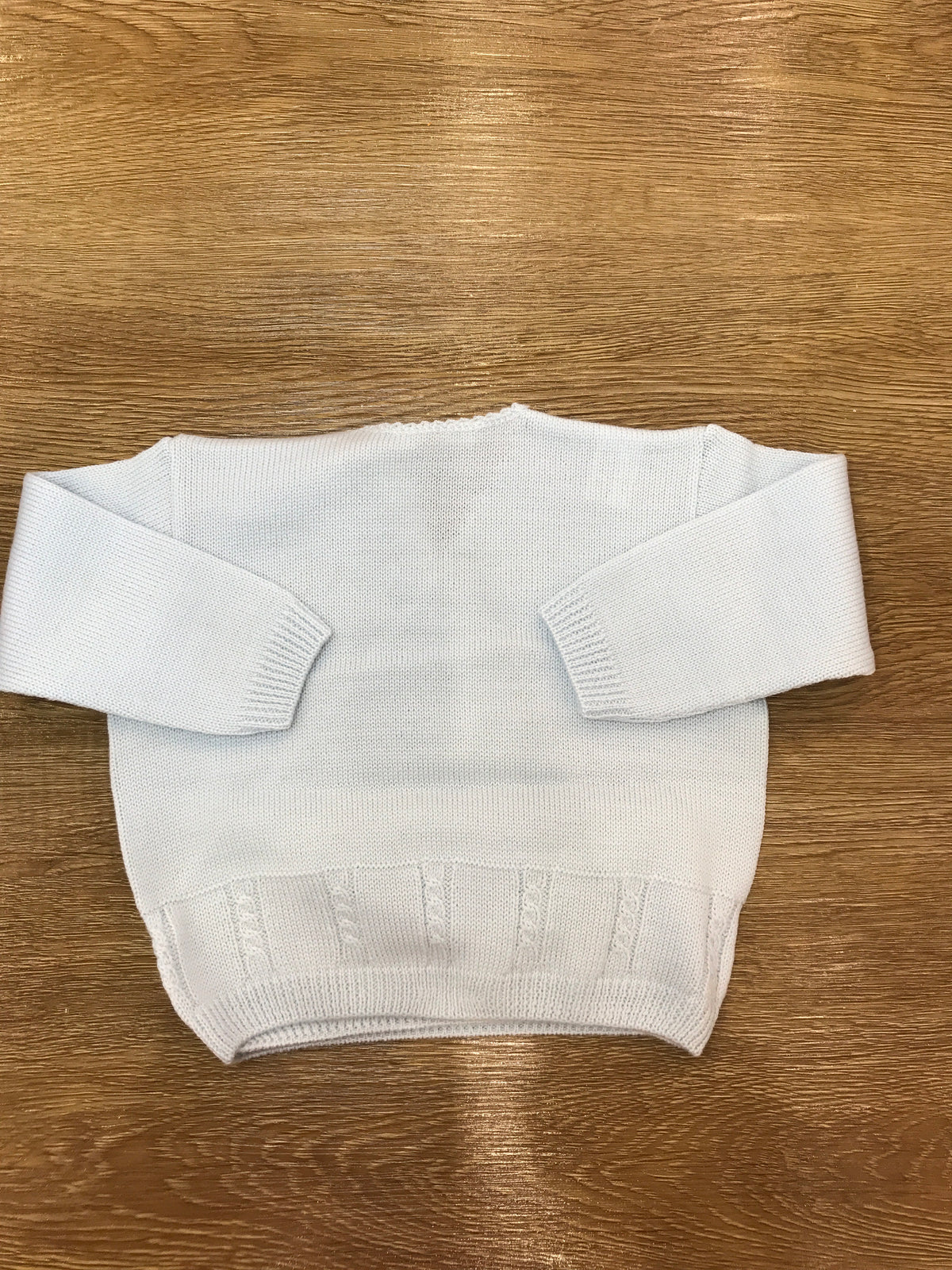 Cardigan Baby Lord in lana celeste ad incrocio con lavorazione di trecce