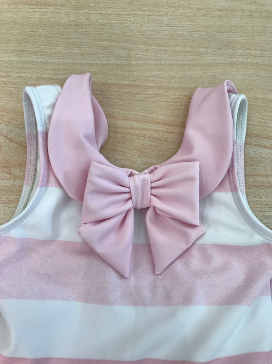 Costume Fofettes intero a righe bianche e rosa con rusche rosa a spallina con fiocco sul davanti