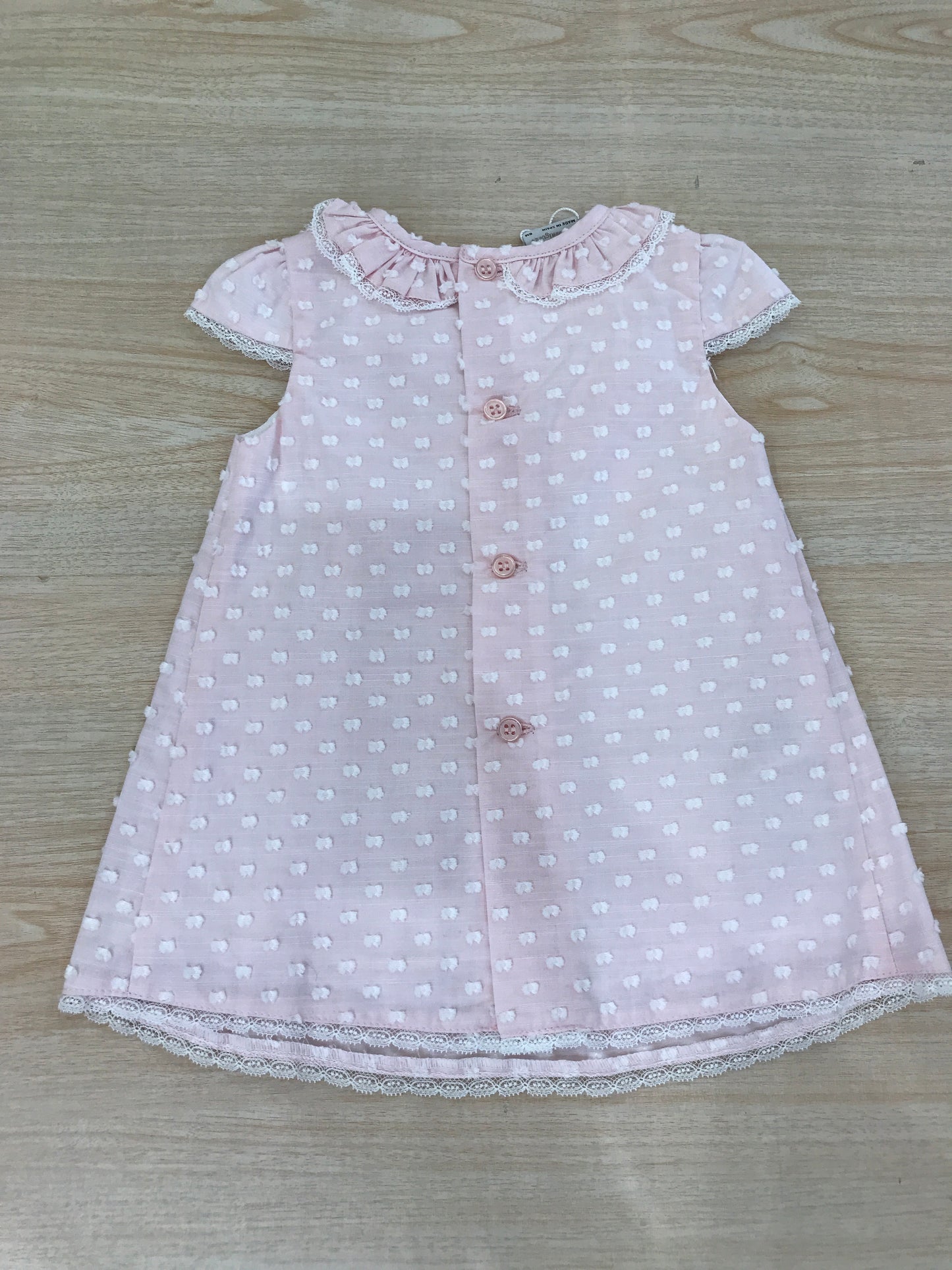 Abito Paz Rodriguez in cotone rosa smanicato con collo con rusche con fiocchetti bianchi