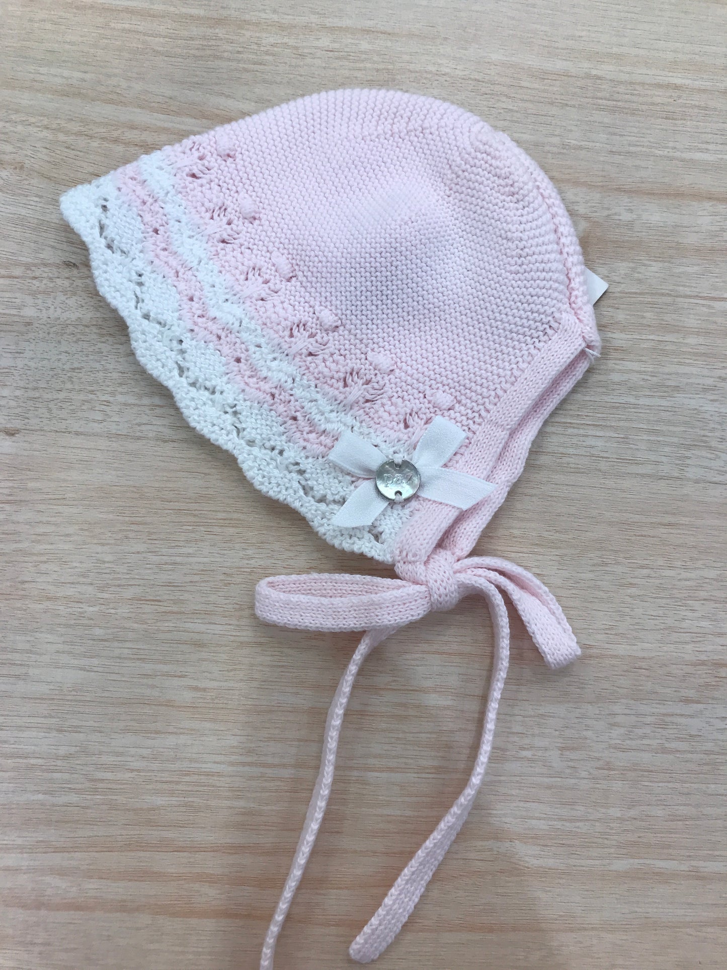 Cuffia Paz Rodriguez in filo rosa con pois in rilievo ricami bianchi e rosa