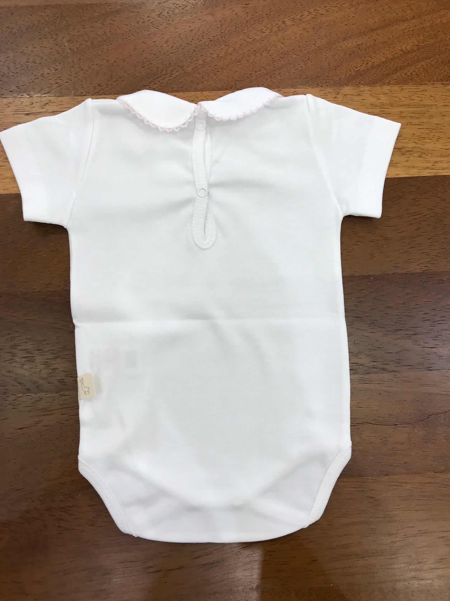 Body Baby Gi mezza manica con collo tondo rifinito con ricami rosa