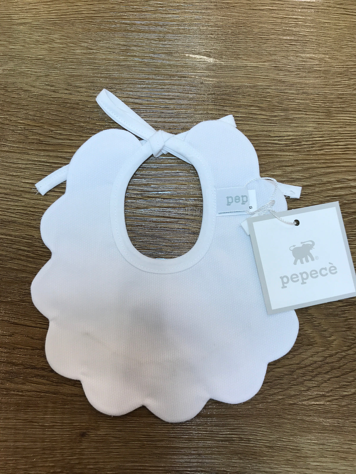 Bavetta Pepecè in piquet smerlata con pois e piccolo fiocchetto in beige