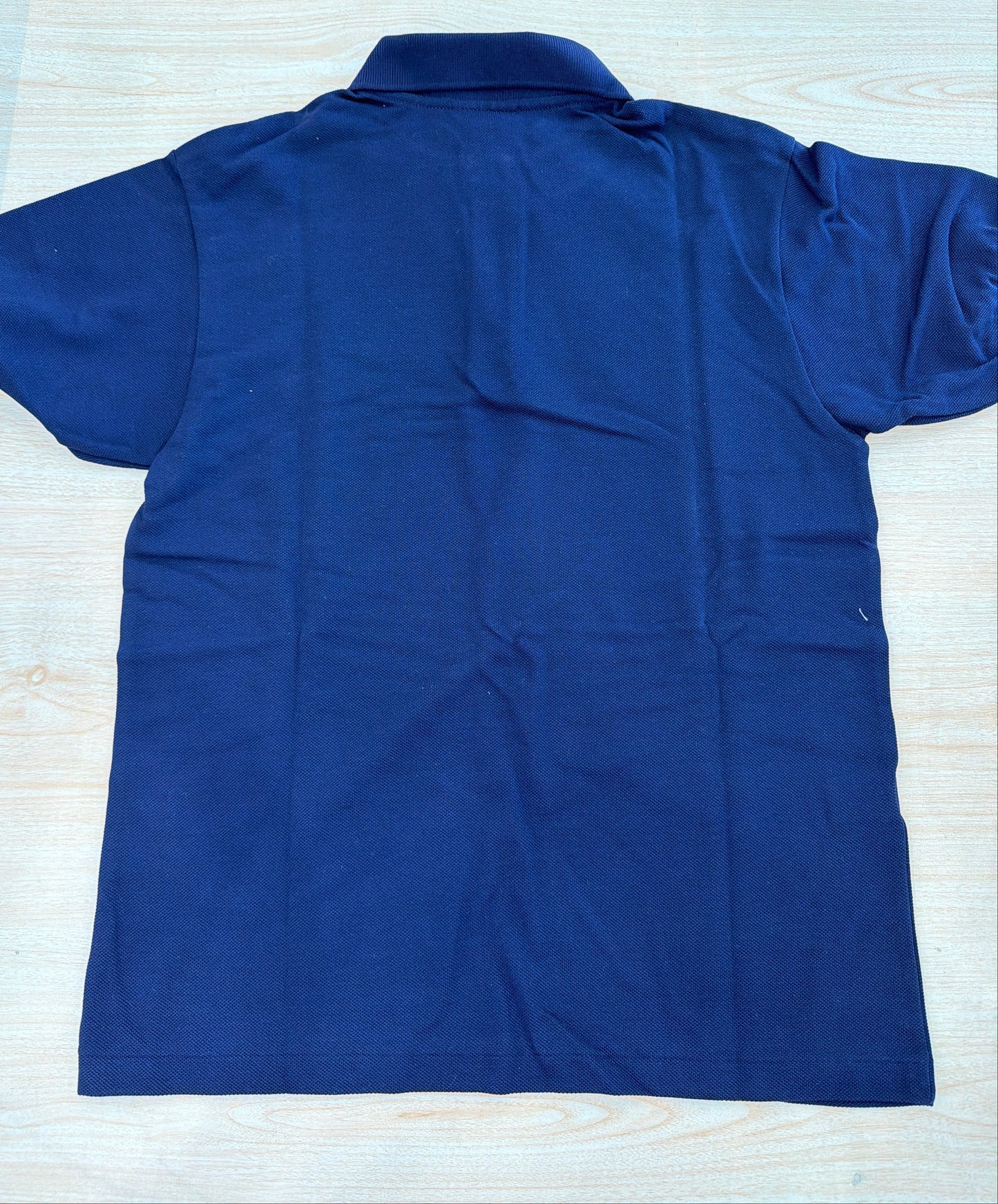 Polo Lacoste in cotone mezza manica con bottoncini e logo ricamato lateralmente unisex