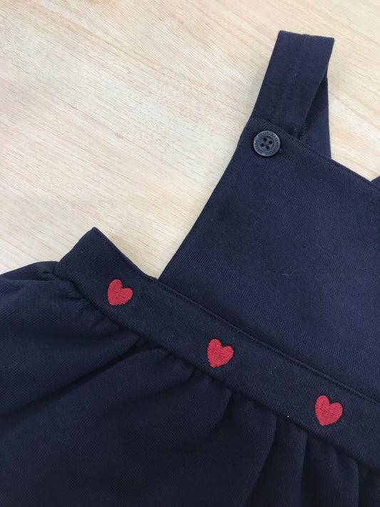 Salopette Petit Bateau blu scuro con bretelle regolabili con cuori ricamati rossi