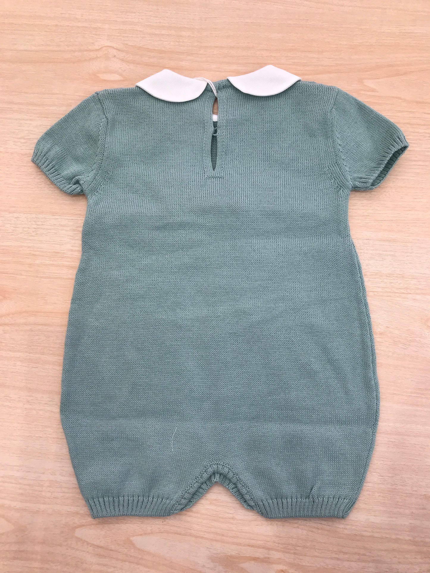 Pagliaccetto Baby Lord in filo verde con fiocco rosa centrale con collo bianco con pois rosa