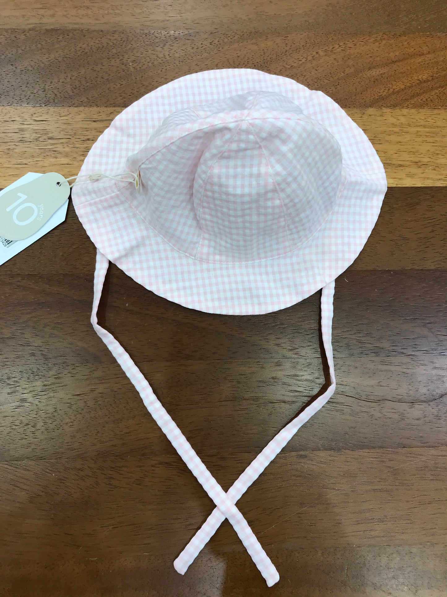 Cappello Baby Gi in cotone a quadretti bianchi e rosa con lacci per fiocchetto