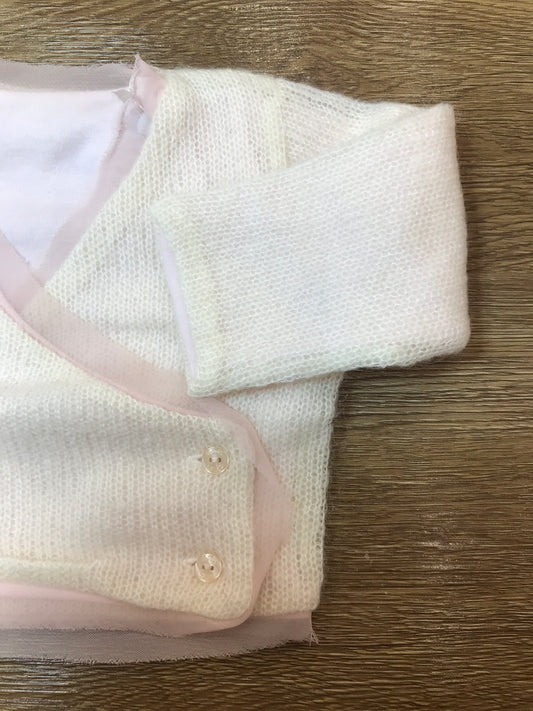 Cardigan Nanan in lana panna con tulle rosa incrociatina con piccoli bottoncini