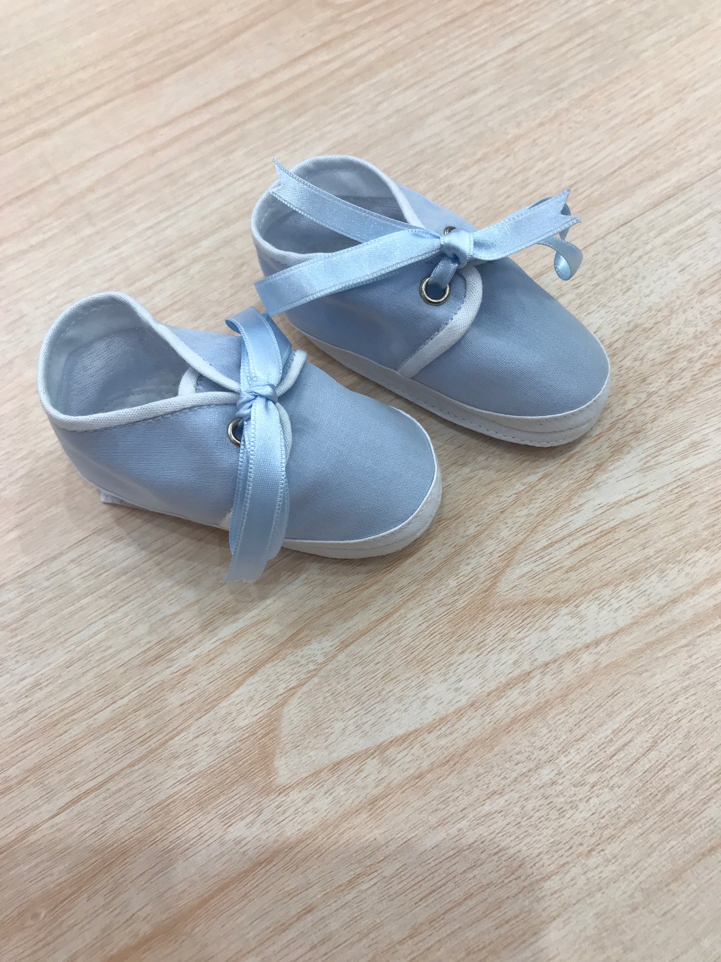 Babbucce Delizie Baby in cotone celeste con fiocchetto