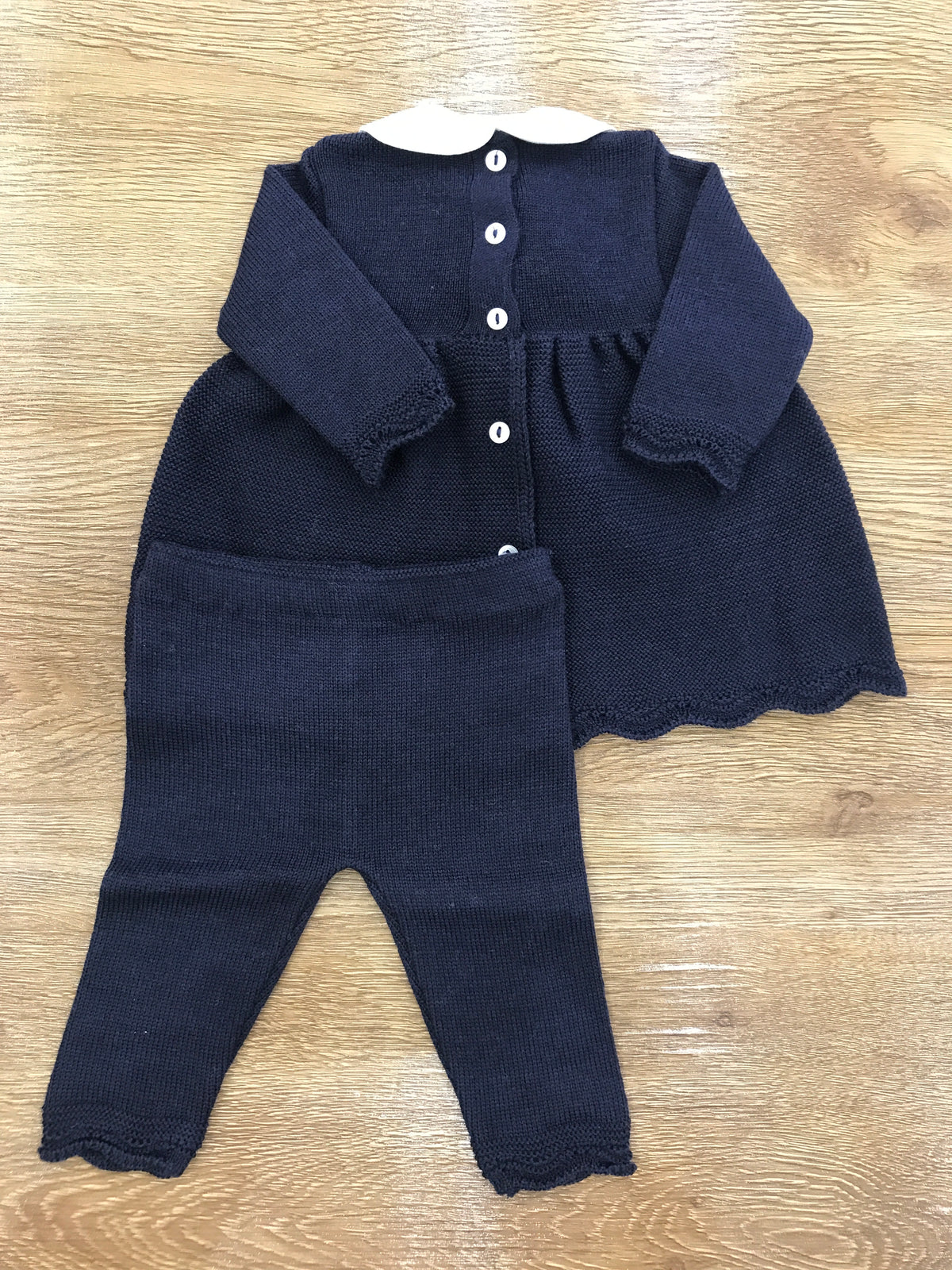 Tutina Baby Lord in lana due pezzi blu scuro con lavorazione di punto smock sul corpetto