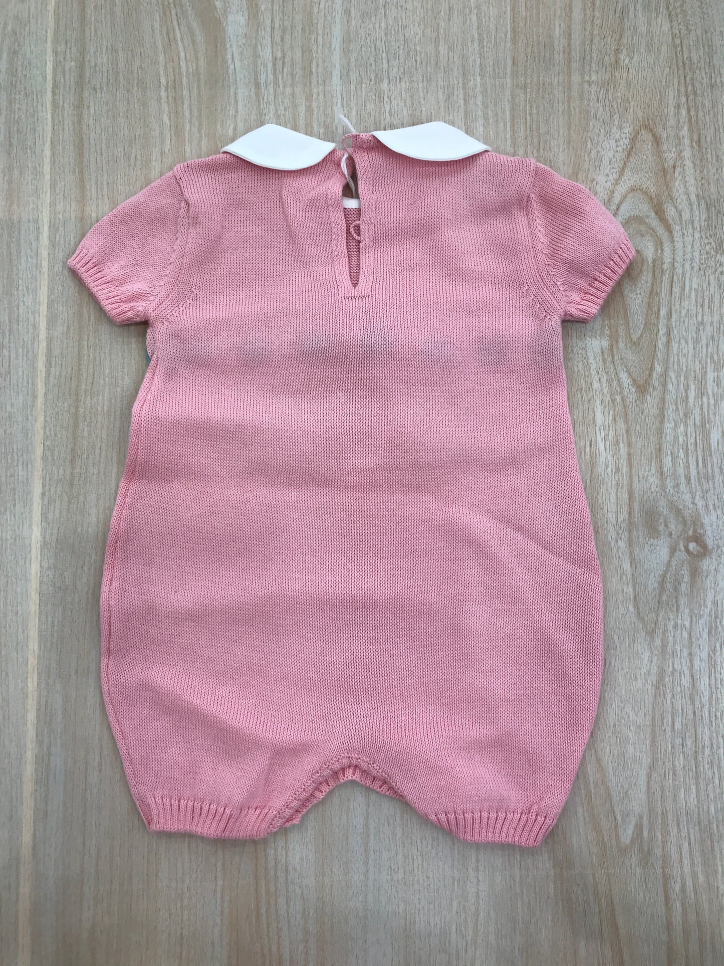 Pagliaccetto Baby Lord in filo rosa e fiocco verde con passanastro