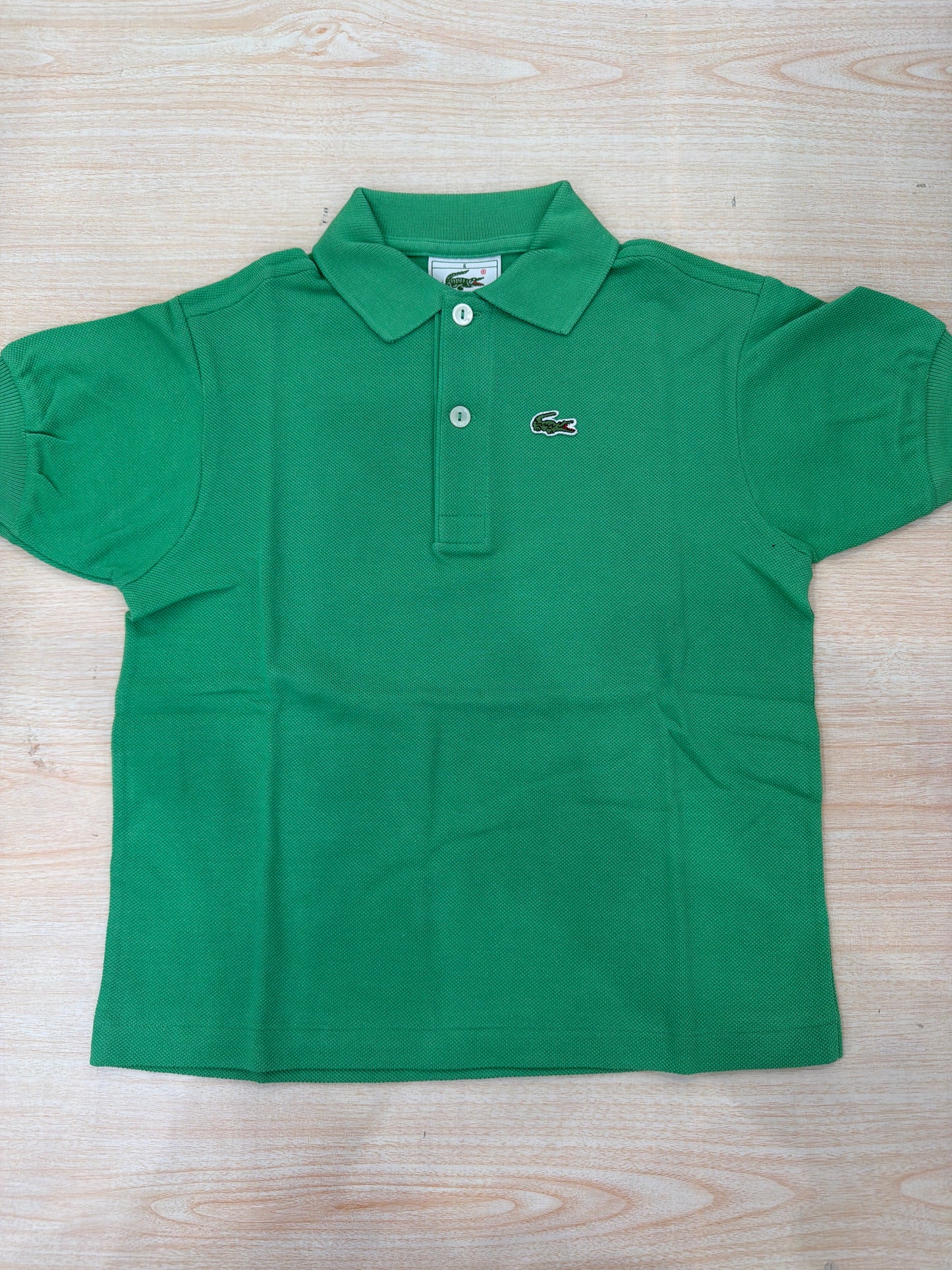 Polo Lacoste in cotone mezza manica con bottoncini e logo ricamato lateralmente unisex