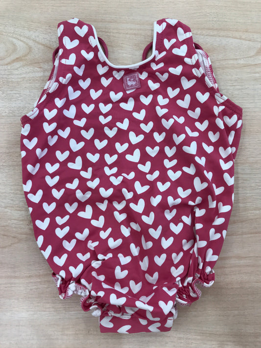 Costume Al Agua Patos intero fucsia a cuoricini bianchi e scollato sul retro