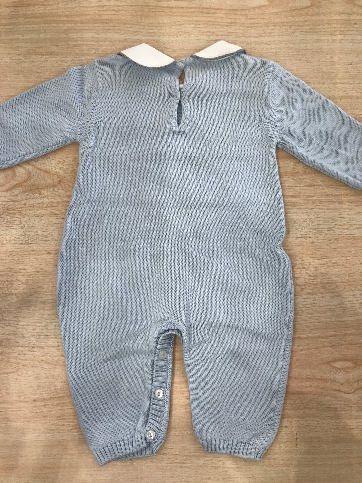 Tutina Baby Lord in filo celeste con passanastro grigio e cuoricini al centro