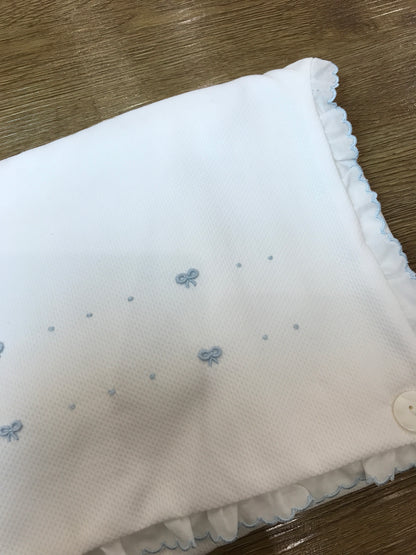 Fasciatoio Pepecè in piquet con spugna all'interno con rusche al bordo e piccoli fiocchetti ricamati con pois sul davanti