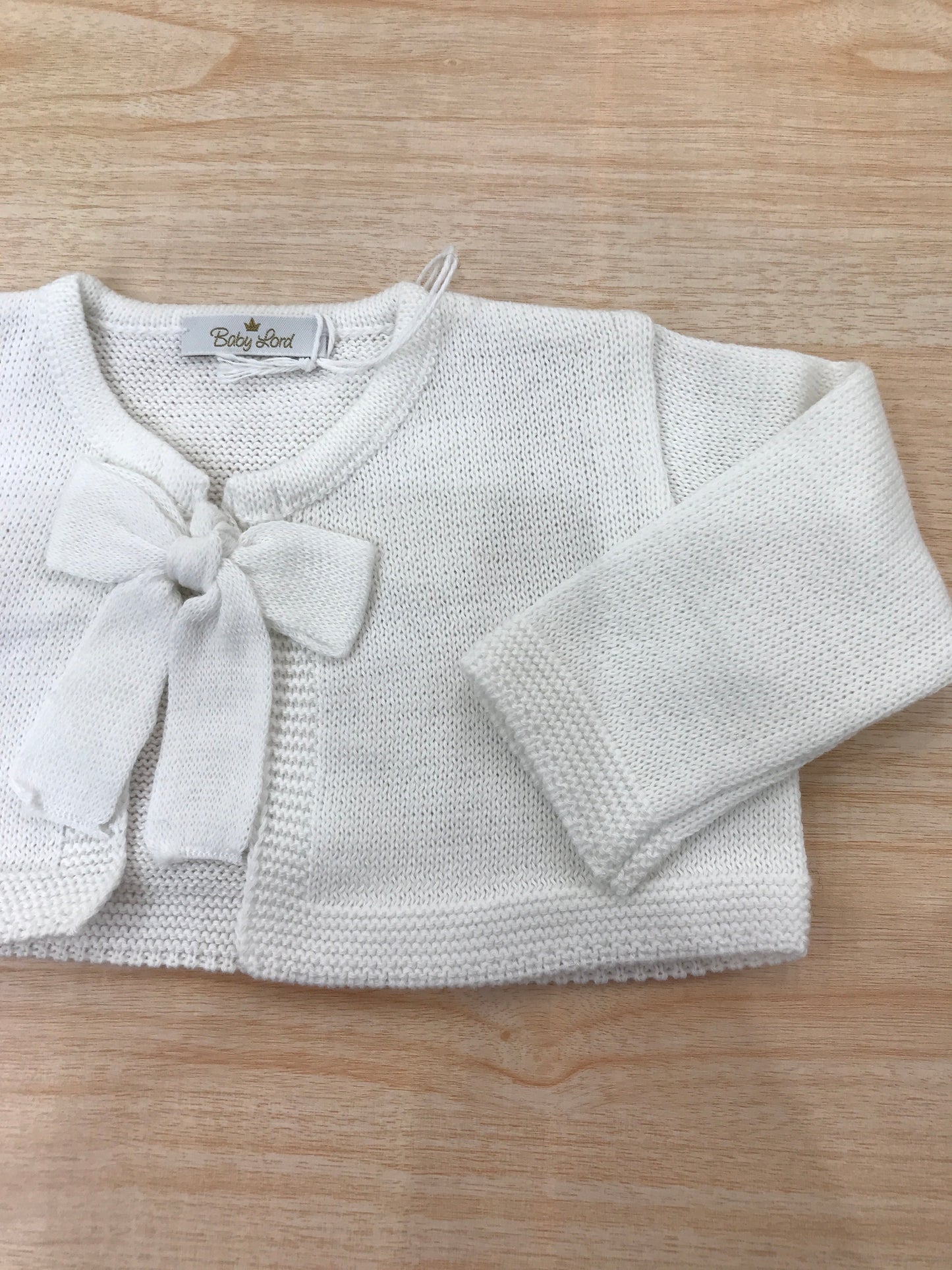Cardigan Baby Lord infilo bianco manica lunga con fiocchetto centrale per chiusura