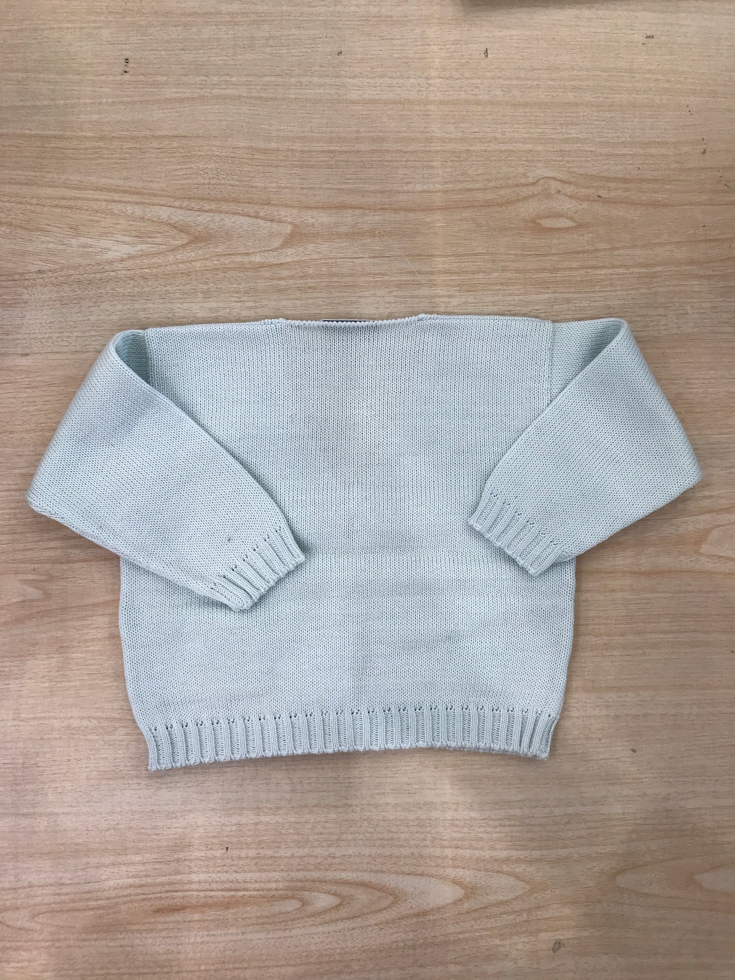 Cardigan Biebi in filo celeste con tasche bucherellate