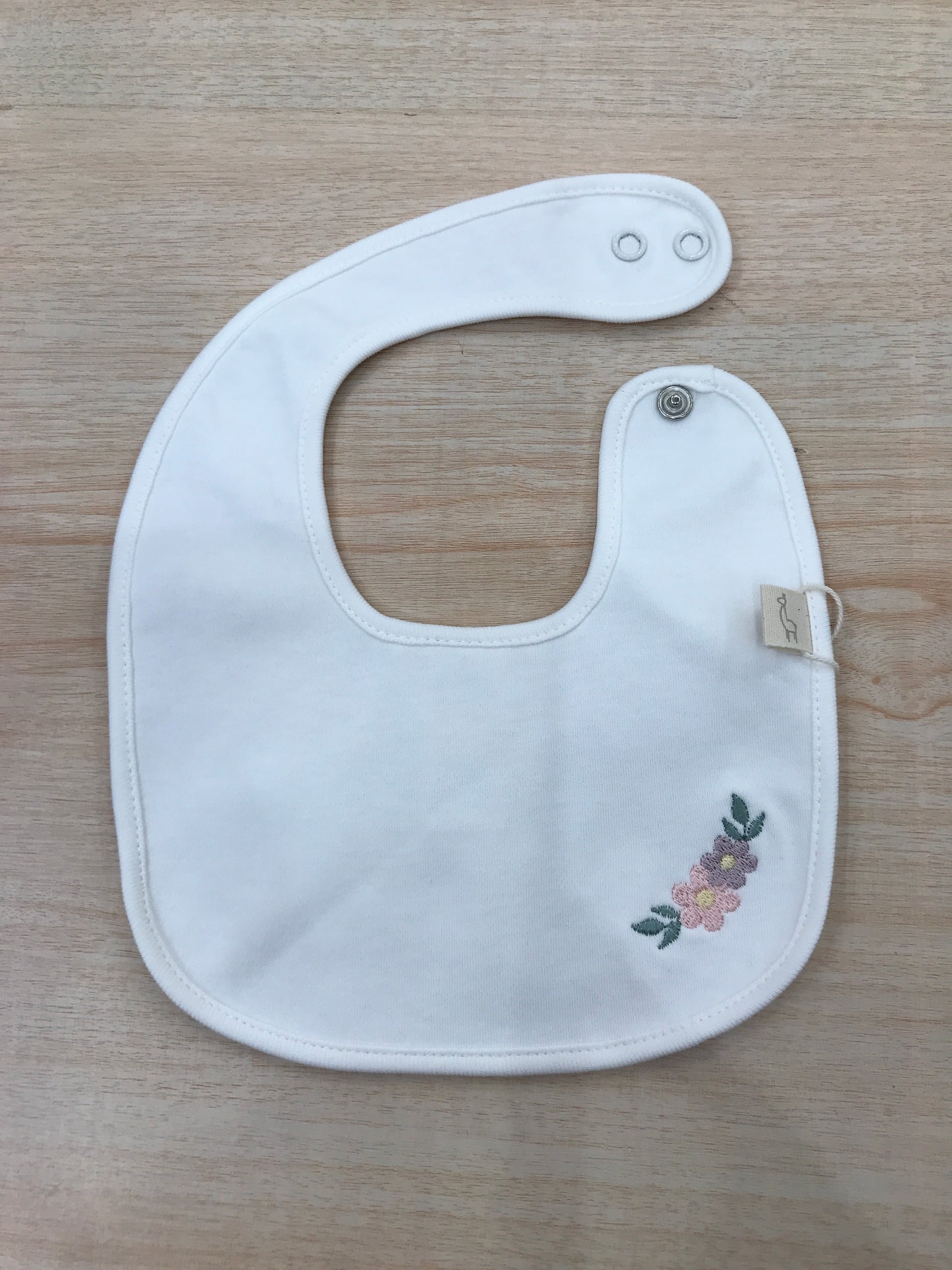 Bavetta Baby Gi in cotone rifinito in ciniglia panna con fiore ricamato