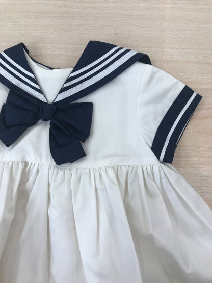 Abito Cielo Blu in cotone bianco e blu a righe stile marinaretto con fiocchetto sul davanti