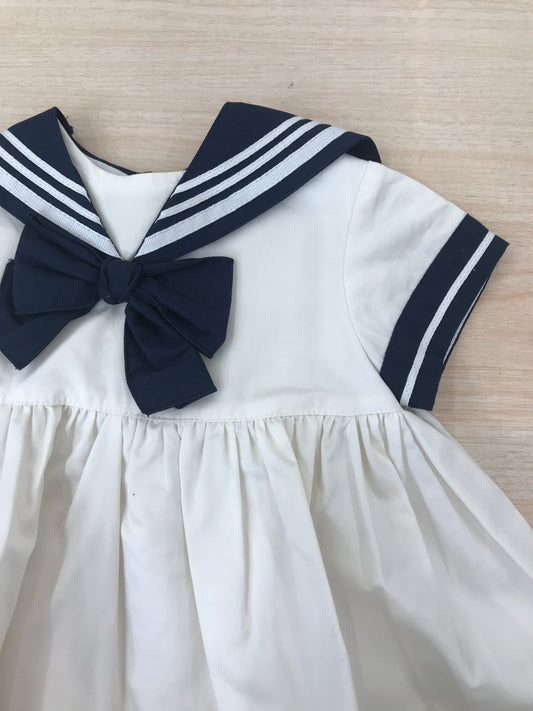 Abito Cielo Blu in cotone bianco e blu a righe stile marinaretto con fiocchetto sul davanti
