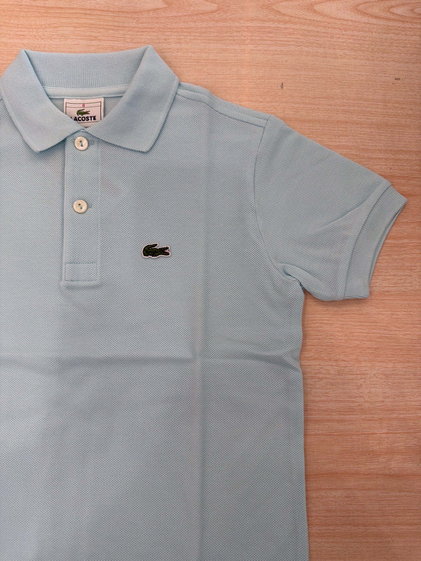Polo Lacoste in cotone mezza manica con bottoncini e logo ricamato lateralmente unisex