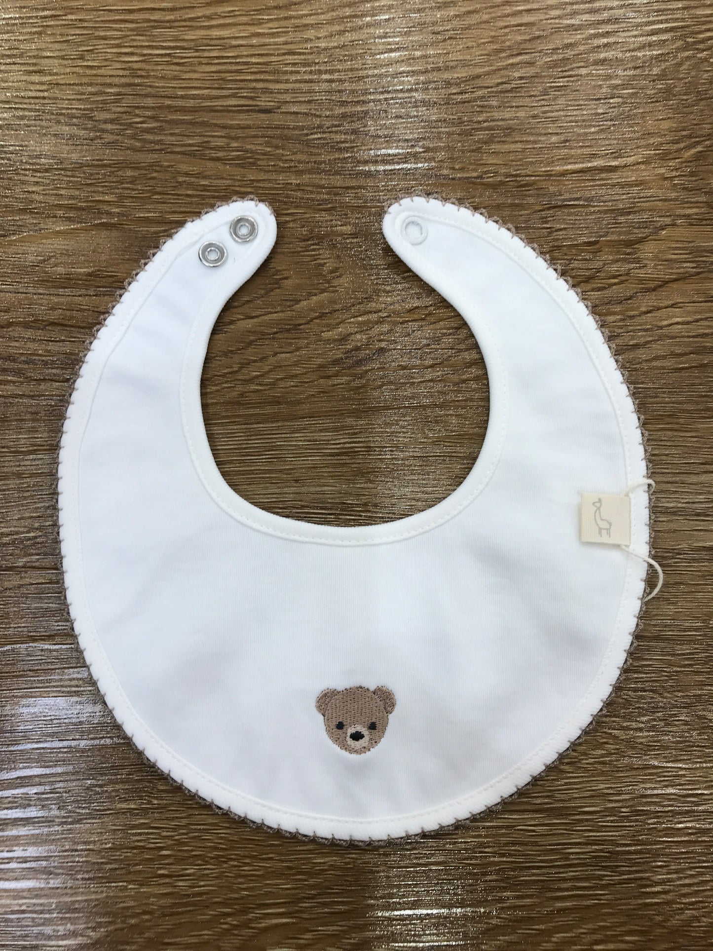 Bavetta Baby Gi in cotone panna rotonda smerlata con orsetto