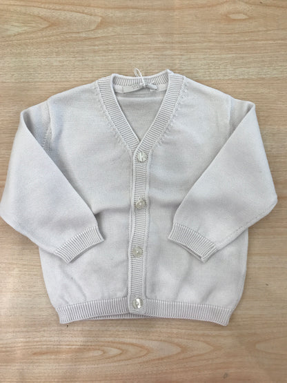 Cardigan Coccodè in filo bianco con scollo a punta e piccoli bottoncini sul davanti