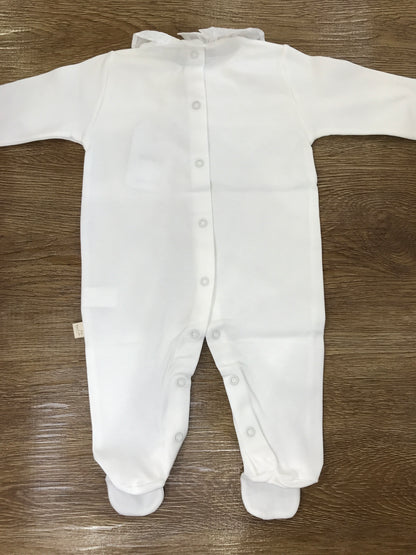 Tutina Baby Gi in cotone panna con rusche e ricamo centrale
