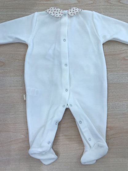 Tutina Baby Gi in ciniglia intera con taschine e fiocchetto floreale sul davanti