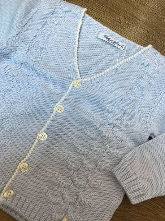 Cardigan Bebè di Almy in lana celeste con lavorazione sul davanti piccoli bottoncini e punto gambero sul davanti