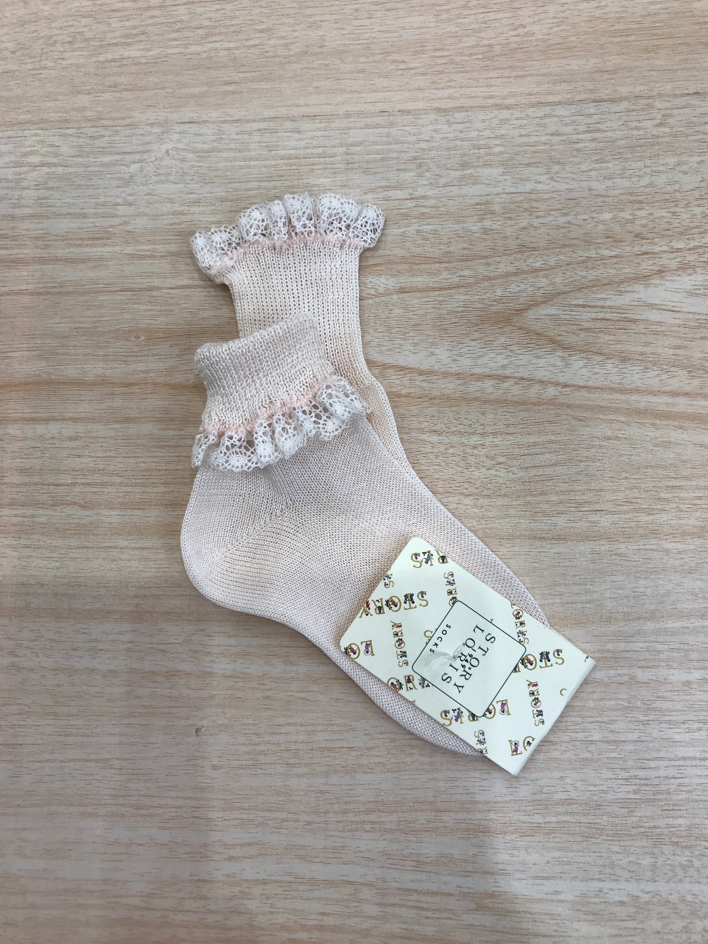 Calzino Story Loris in filo rosa con rusche al bordo