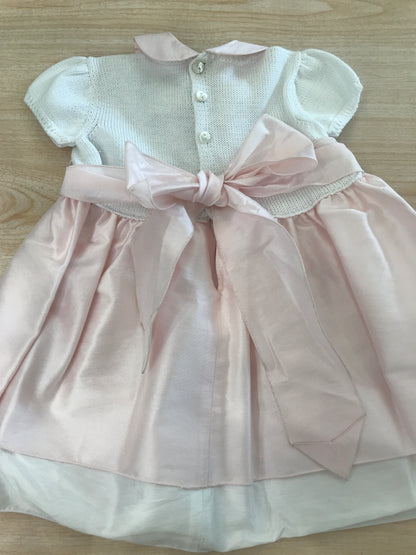Abito Colibrì con corpetto in filo di cotone mezza manica con fiori rosa ricamati a mano con gonna con doppia balza rosa e bianca